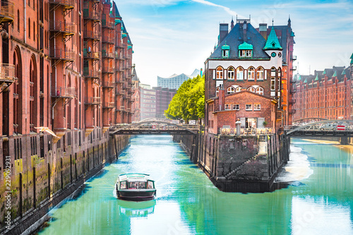 Hamburg Speicherstadt with sightseeing tour boat in summer, Germany