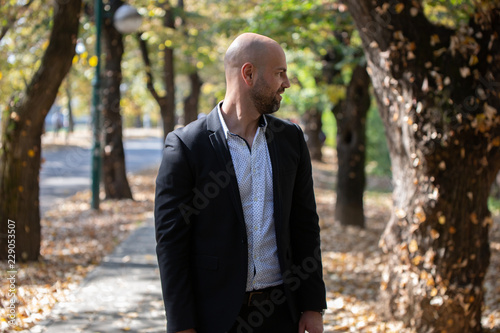 Young businessman in park