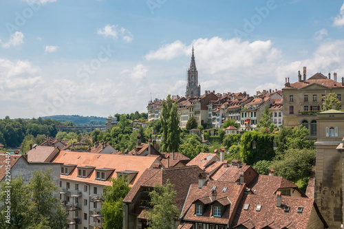 Panoramic view on Bern Minster and historic old town of Bern, capital of Switzerland, Europe. Summer landscape, sunny day and blue sky