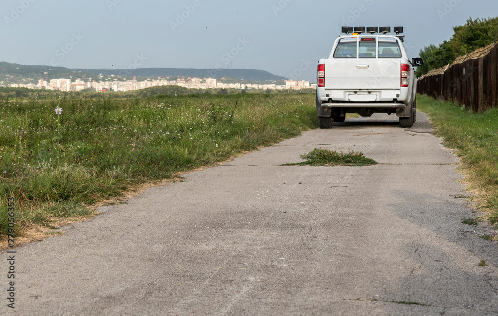 A service jeep at the airport that checks for security. A service jeep at the airport that checks for security.