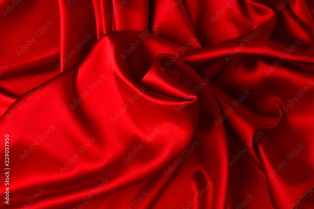 Red silk or satin luxury fabric texture can use as abstract background. Top view Red silk or satin luxury fabric texture can use as abstract background. Top view