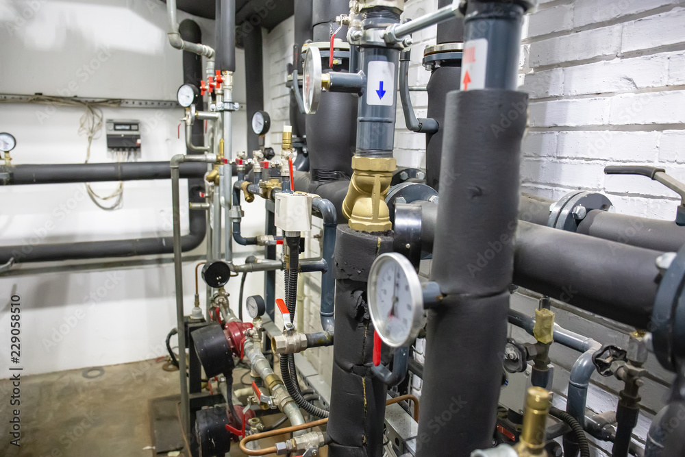 House heating system with many steel pipes, manometers and metal tubes House heating system with many steel pipes, manometers and metal tubes