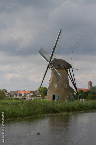 A windmill  symbol of the Dutch countryside  in Kinderdijk  The Netherlands 