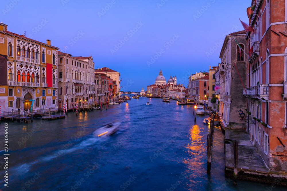 Obraz premium Grand Canal with Basilica di Santa Maria della Salute in Venice, Italy. Night view of Venice Grand Canal. Architecture and landmarks of Venice. Venice postcard