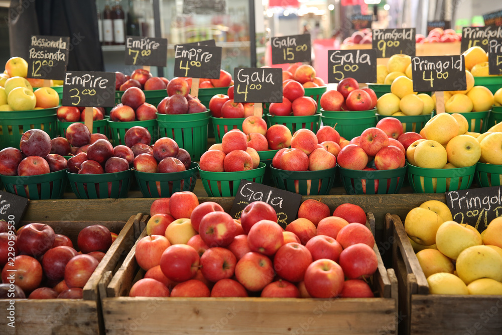 red apples in baskets at the farmers market red apples in baskets at the farmers market