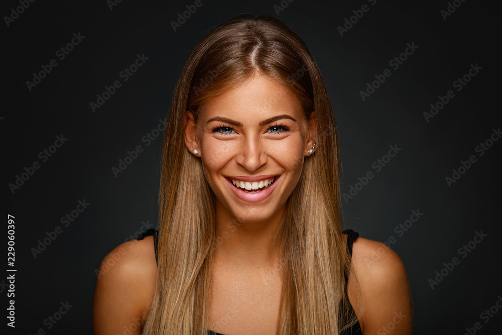 Portrait of young smiling blonde in studio Portrait of young smiling blonde in studio