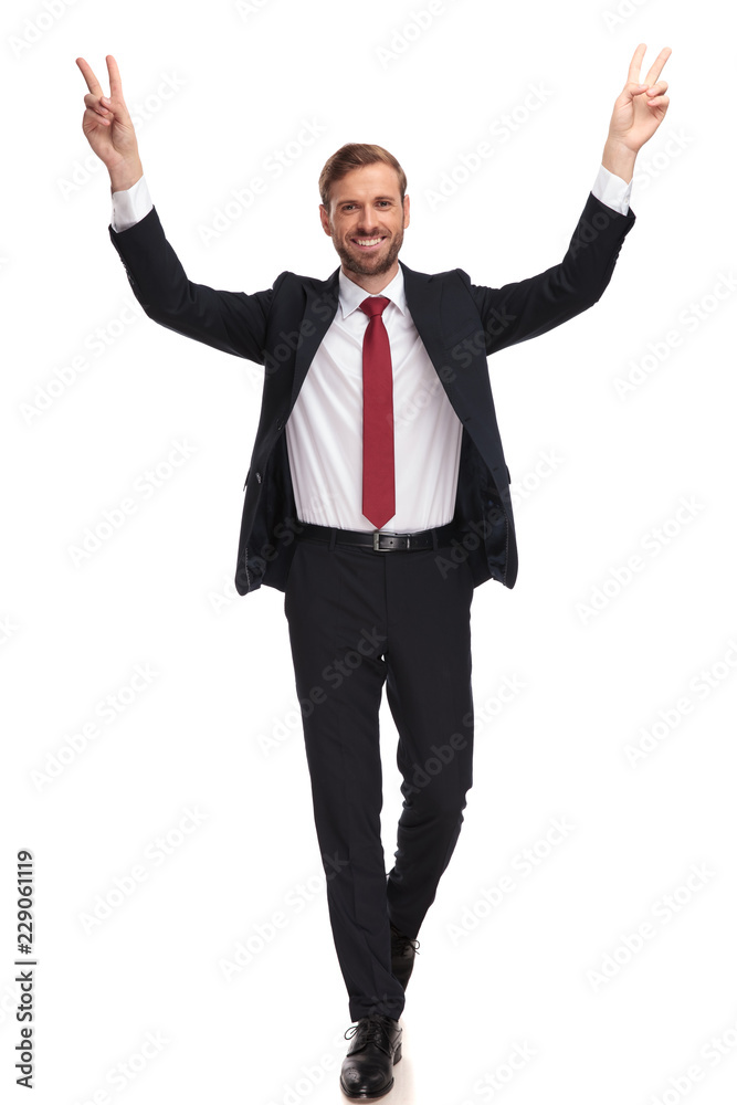 happy businessman walking and celebrating with hands in the air happy businessman walking and celebrating with hands in the air