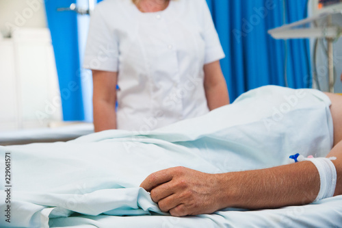 Patient in hospital ward