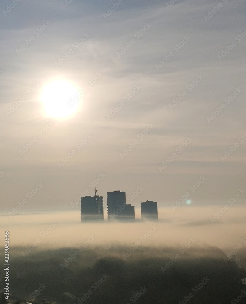 Apocalyptic buildngs with clouds background photo, mist and fog conceptual photo background