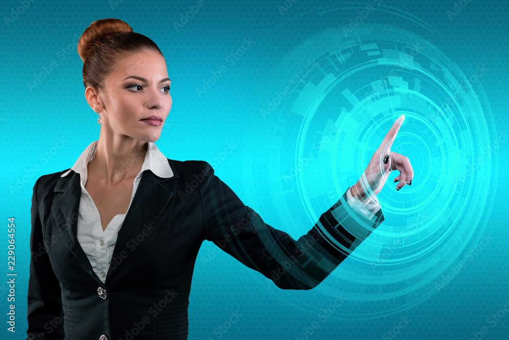 Young business lady works with virtual graphic interface in futuristic office Young business lady works with virtual graphic interface in futuristic office
