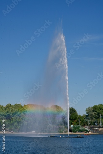 Water fountain reflecting a rainbow