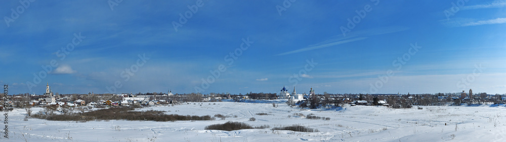 Russian towns - Winter panorama of Suzdal under blue sky, Vladimir region, Russia