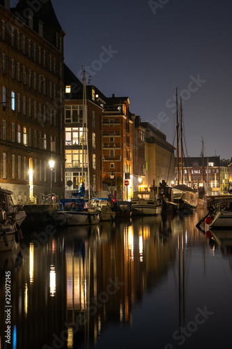 Cozy christianshavn channel in the danish capital of Copenhagen. This is the harbor for many liveaboard and boats made for housing