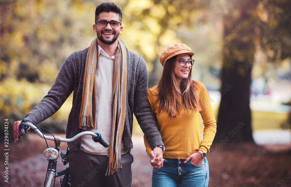 Meeting in the park. Romantic couple in the autumn park. Love, dating, romance Meeting in the park. Romantic couple in the autumn park. Love, dating, romance