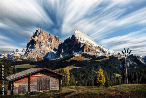 Hut with Alpe di Siusi - Seiser Alm with Sassolungo - Langkofel and Plattkofel mountains in background