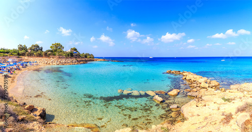 Fototapeta Naklejka Na Ścianę i Meble -  A view of a azzure water and Nissi beach in Aiya Napa, Cyprus