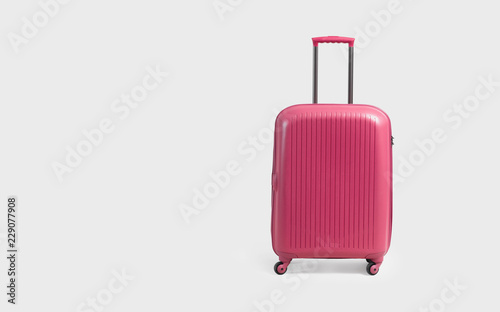 Bilde på lerret Pink trolley suitcase isolated on white