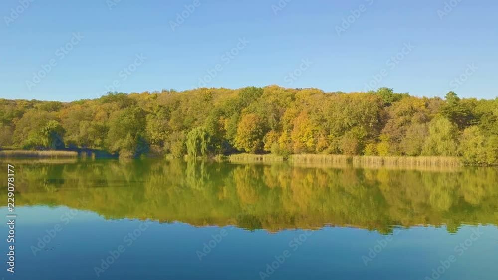 Flight over the autumn lake in the park, Autumn nature aerial landscape, flight over beautiful park with ponds and lakes, Autumn nature aerial landscape flight over lake and brightly colored forest Flight over the autumn lake in the park, Autumn nature aerial landscape, flight over beautiful park with ponds and lakes, Autumn nature aerial landscape flight over lake and brightly colored forest