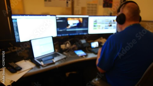 Man Working with Multiple Monitors Out of Focus 4K