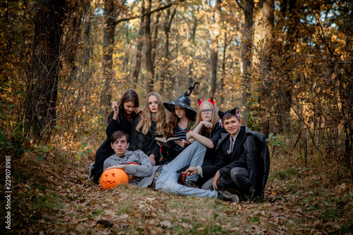 Teenagers in Halloween costumes in the woods © volody10