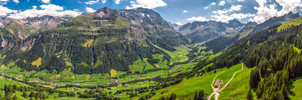 Aerial view of Elm village and Swiss mountains - Piz Segnas, Piz Sardona, Laaxer Stockli from Ampachli, Glarus, Switzerland, Europe Aerial view of Elm village and Swiss mountains - Piz Segnas, Piz Sardona, Laaxer Stockli from Ampachli, Glarus, Switzerland, Europe