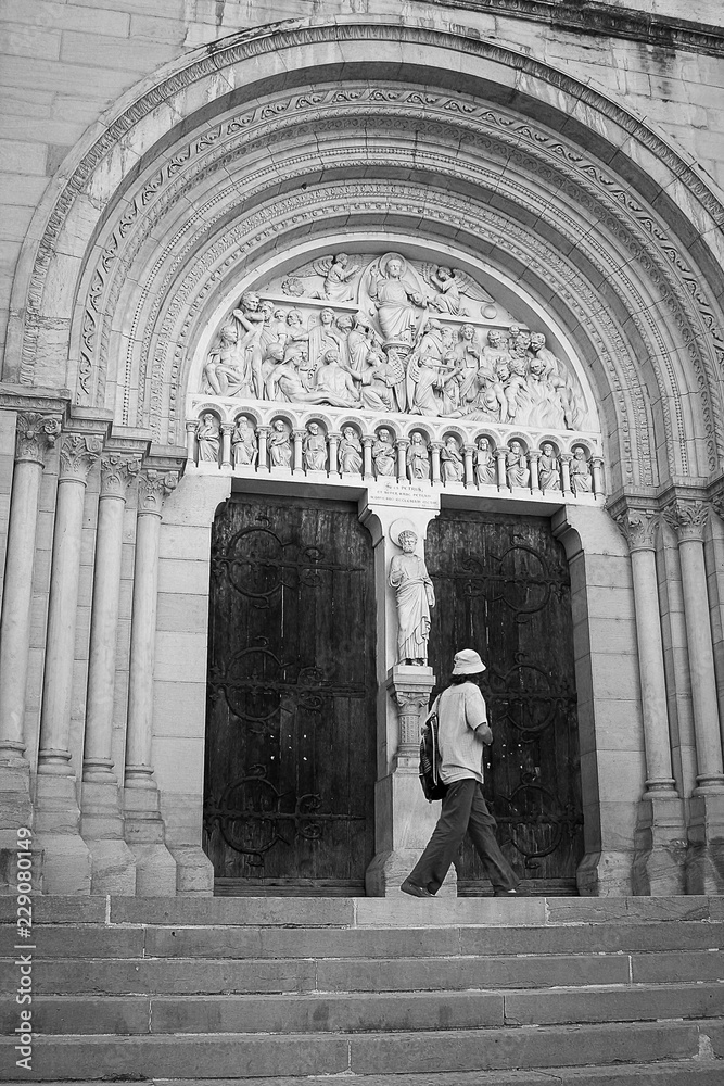 The man exploring old cathedral in Macon.