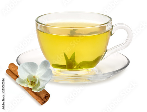 Title: Green tea in cup with leaves on white background including clipping path