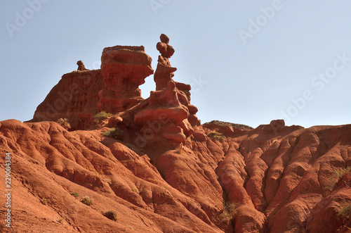 Red pinnacles of sandstone rocks of Konorchek gorge,Kyrgyzian Grand Canyon,famous natural landmark and hiking place,Issyk-Kul lake region,Central Asia photo