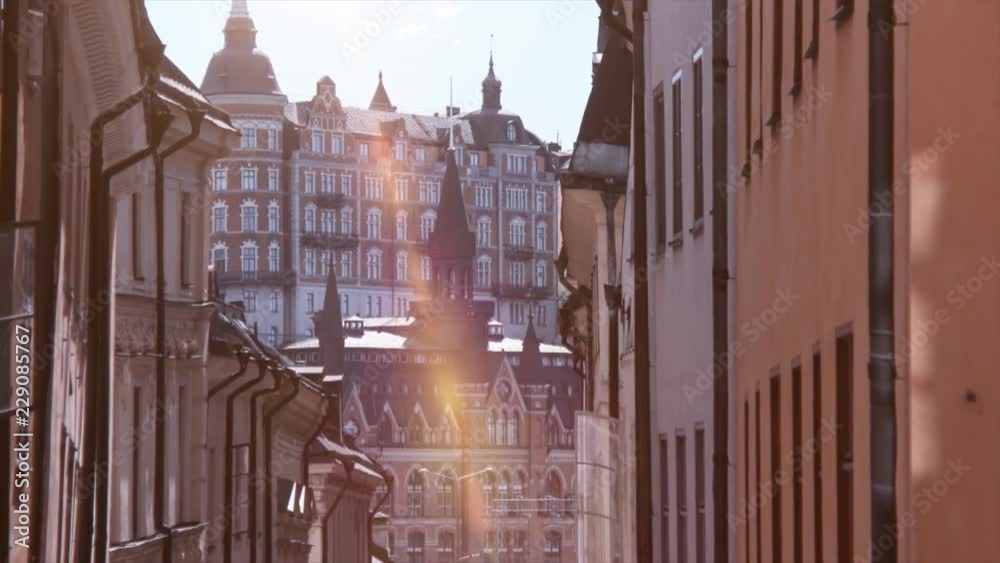 4K Brick houses in Stockholm. Tower and city square with sunshine in summer time. Baroque buildings and landmark of Sweden. 