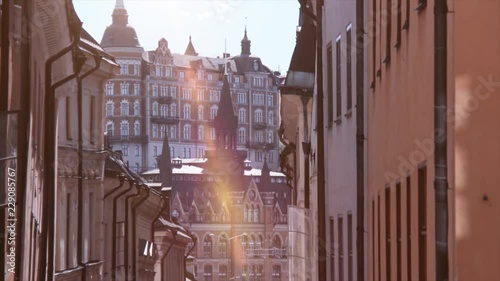 4K Brick houses in Stockholm. Tower and city square with sunshine in summer time. Baroque buildings and landmark of Sweden. 