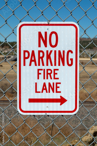 No parking fire lane sign on fence