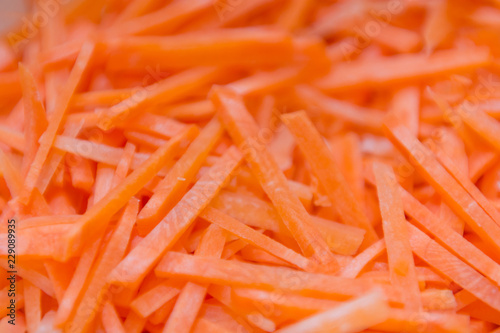 Carrot texture. Carrot background. Cut into pieces, straw.
