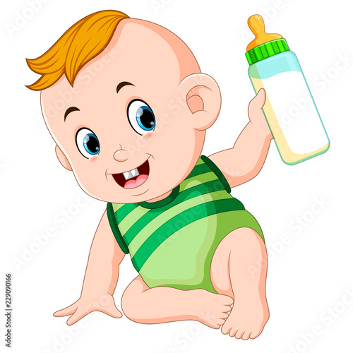 the cute baby playing and hold the milk bottle