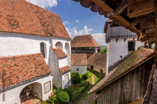 Summer view of UNESCO medieval fortified church of Viscri Romania photo