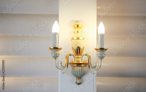 Old vintage wall lamp. Vintage style lamp with candlesticks