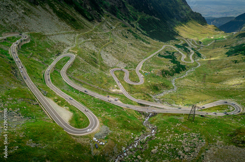 Aerial view of Balea lake and curving road of the Transfagaras pass in Romania photo