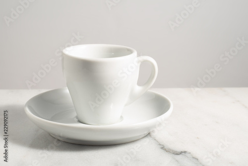 Wallpaper Mural Empty espresso coffee cup isolated over white granite or clear marble with white background Torontodigital.ca