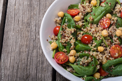 Spinach salad with quinoa , tomatoes and chickpea