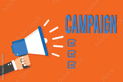 Word writing text Campaign. Business concept for organized course of action to promote and sell product service Man holding megaphone loudspeaker orange background message speaking loud photo