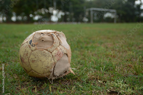 old ball on football field