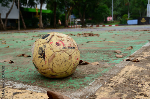 old ball on concrete field