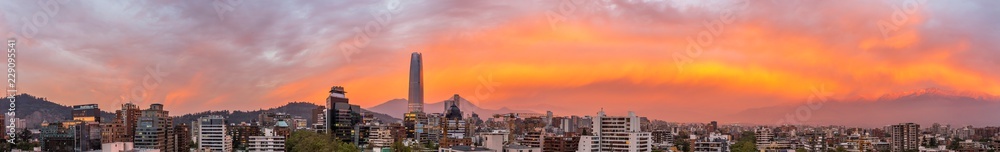Amazing panoramic views of Santiago city, Chile, during sunset with the Andes mountain range making an awe horizon on a colorful cloudy day making an amazing cityscape panorama in high resolution Amazing panoramic views of Santiago city, Chile, during sunset with the Andes mountain range making an awe horizon on a colorful cloudy day making an amazing cityscape panorama in high resolution
