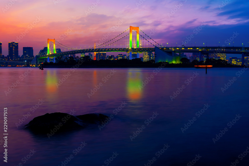 Colorful illuminations at Rainbow Bridge from Odaiba in Tokyo, Japan