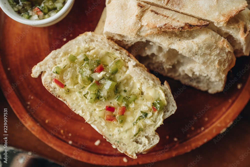 Appetizer food ; Bread and butter serve on wooden plate Appetizer food ; Bread and butter serve on wooden plate