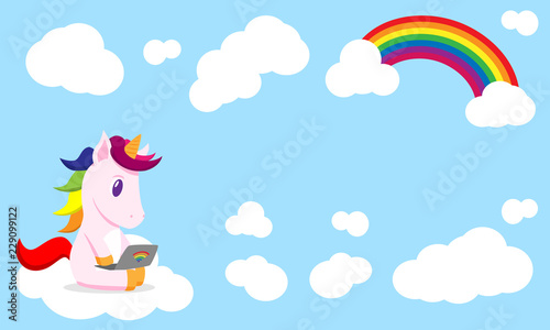 flat cartoon unicorn with laptop in the clouds photo