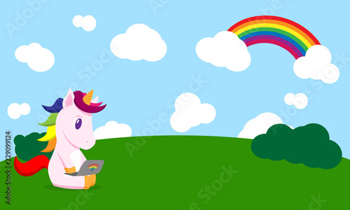 flat cartoon unicorn with laptop in the field photo