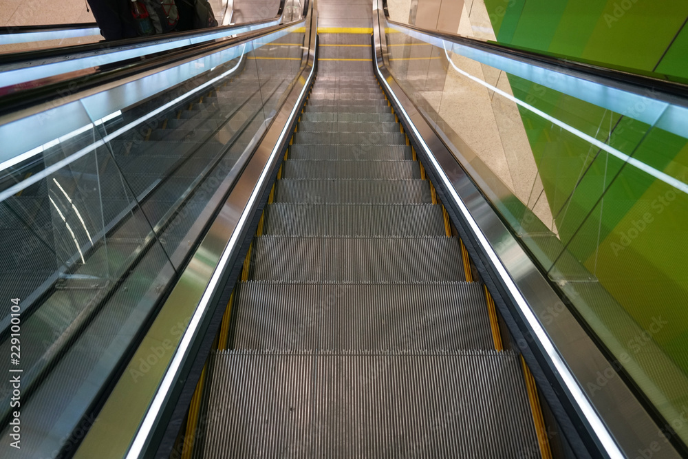high angle view of escalator in the airport high angle view of escalator in the airport
