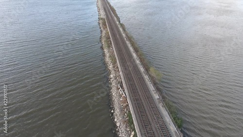 Wallpaper Mural Train passing under camera. Aerial view of train tracks cutting across water. Torontodigital.ca