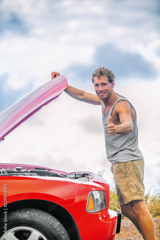 Car maintenance mechanic checking engine with open hood on road trip - happy customer man doing thumbs up for good inspection of motor on sports automobile. Roadside repair help assistance.