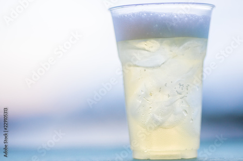 The background of ice cold water and soft drinks (soft drinks, beer, liqueurs, drinking water) has the vapor dispersed around the glass, a beautiful one, the colorful wallpapers of bubbles.